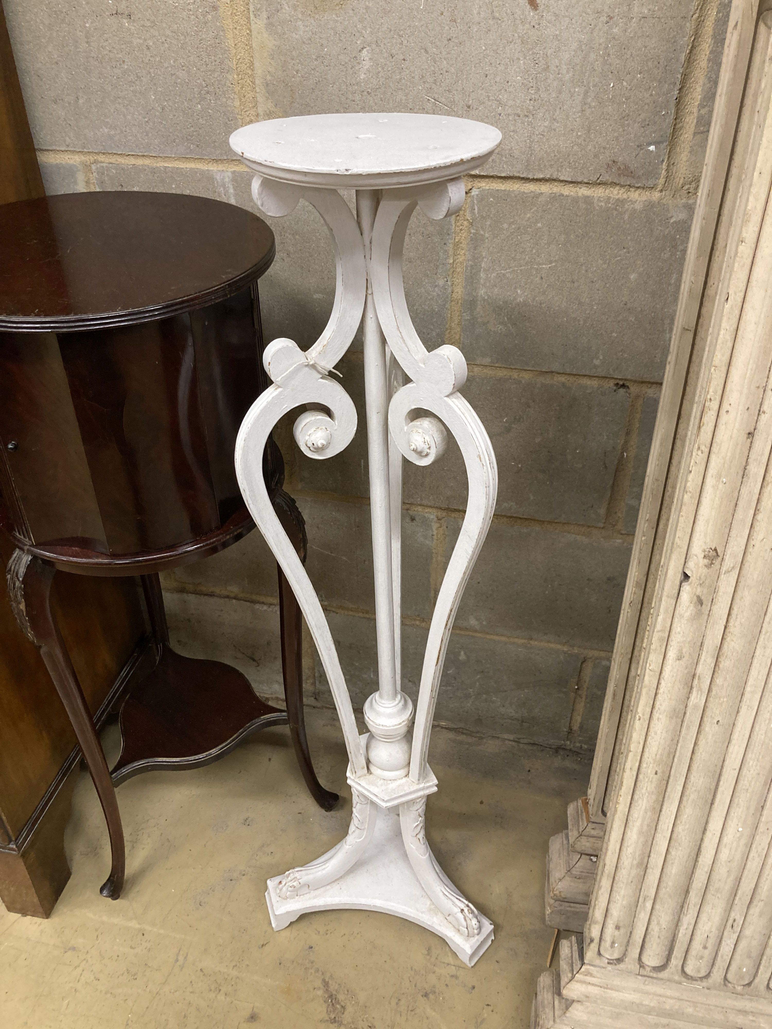 An Edwardian mahogany circular jardiniere stand, 34cm diameter, 89cm high together with a painted plant stand